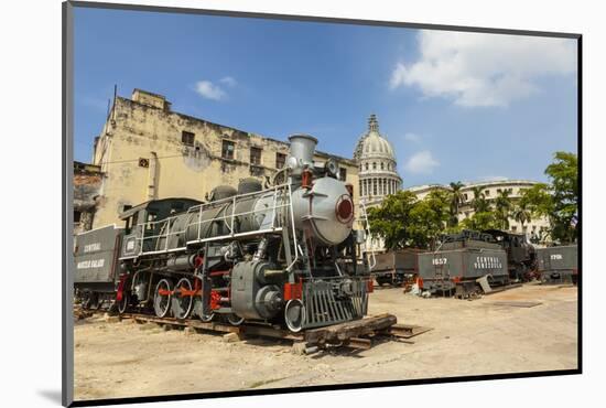 A Vintage Steam Train in a Restoration Yard with Dome of Former Parliament Building in Background-Sean Cooper-Mounted Photographic Print