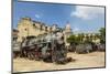 A Vintage Steam Train in a Restoration Yard with Dome of Former Parliament Building in Background-Sean Cooper-Mounted Photographic Print