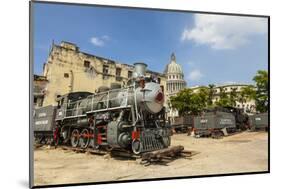 A Vintage Steam Train in a Restoration Yard with Dome of Former Parliament Building in Background-Sean Cooper-Mounted Photographic Print