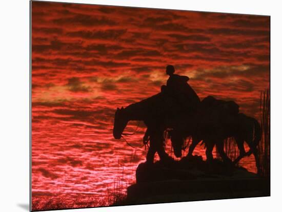 A Vivid Late-Autumn Sunset Silhouettes the Statue Known as Pioneer Mother at Penn Valley Park-null-Mounted Photographic Print