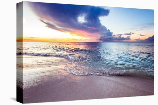 A Wave Crashes Over A Pink Sand Beach In The Bahamas At Sunset-Erik Kruthoff-Stretched Canvas