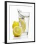 A Wedge of Lemon Falling into a Glass of Water-Kröger & Gross-Framed Photographic Print