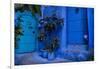 A white cat peeks out a blue door. Chefchaouen, Morocco-Karine Aigner-Framed Photographic Print