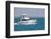 A White Sport Fishing Boat, Flying the US Yacht Ensign, Heads towards the Open Sea.-Gary Blakeley-Framed Photographic Print