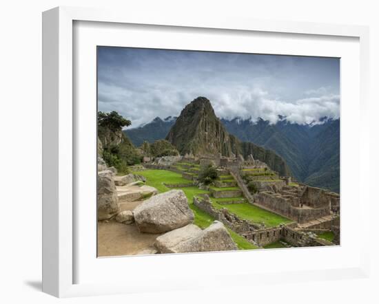 A wide angle photo of Macchu Pichu at sunrise with dramatic clouds in the distance.-Alex Saberi-Framed Premium Photographic Print