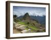 A wide angle photo of Macchu Pichu at sunrise with dramatic clouds in the distance.-Alex Saberi-Framed Photographic Print