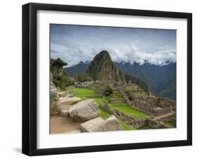 A wide angle photo of Macchu Pichu at sunrise with dramatic clouds in the distance.-Alex Saberi-Framed Photographic Print