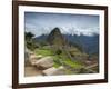 A wide angle photo of Macchu Pichu at sunrise with dramatic clouds in the distance.-Alex Saberi-Framed Photographic Print