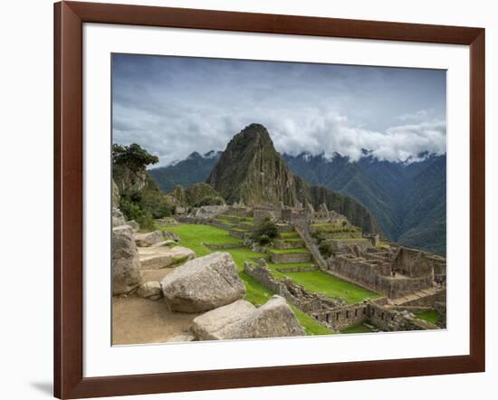 A wide angle photo of Macchu Pichu at sunrise with dramatic clouds in the distance.-Alex Saberi-Framed Photographic Print