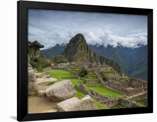 A wide angle photo of Macchu Pichu at sunrise with dramatic clouds in the distance.-Alex Saberi-Framed Photographic Print