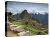 A wide angle photo of Macchu Pichu at sunrise with dramatic clouds in the distance.-Alex Saberi-Stretched Canvas