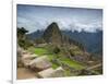 A wide angle photo of Macchu Pichu at sunrise with dramatic clouds in the distance.-Alex Saberi-Framed Photographic Print
