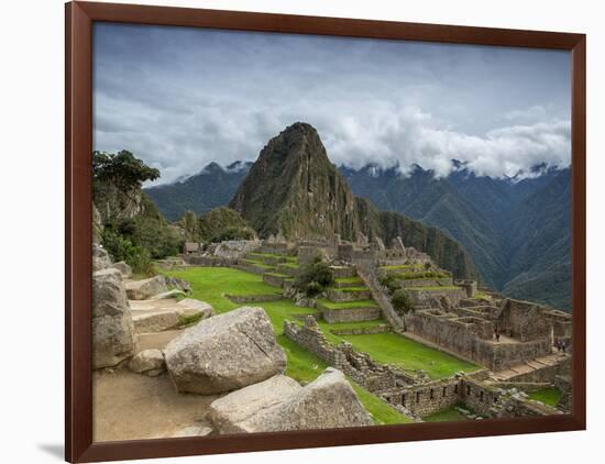 A wide angle photo of Macchu Pichu at sunrise with dramatic clouds in the distance.-Alex Saberi-Framed Photographic Print