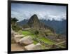 A wide angle photo of Macchu Pichu at sunrise with dramatic clouds in the distance.-Alex Saberi-Framed Photographic Print