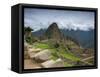 A wide angle photo of Macchu Pichu at sunrise with dramatic clouds in the distance.-Alex Saberi-Framed Stretched Canvas