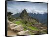 A wide angle photo of Macchu Pichu at sunrise with dramatic clouds in the distance.-Alex Saberi-Framed Stretched Canvas