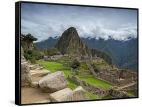 A wide angle photo of Macchu Pichu at sunrise with dramatic clouds in the distance.-Alex Saberi-Framed Stretched Canvas