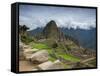 A wide angle photo of Macchu Pichu at sunrise with dramatic clouds in the distance.-Alex Saberi-Framed Stretched Canvas