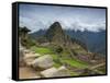 A wide angle photo of Macchu Pichu at sunrise with dramatic clouds in the distance.-Alex Saberi-Framed Stretched Canvas