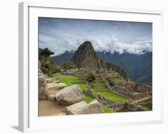 A wide angle photo of Macchu Pichu at sunrise with dramatic clouds in the distance.-Alex Saberi-Framed Photographic Print