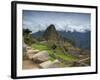 A wide angle photo of Macchu Pichu at sunrise with dramatic clouds in the distance.-Alex Saberi-Framed Photographic Print