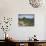 A wide angle photo of Macchu Pichu at sunrise with dramatic clouds in the distance.-Alex Saberi-Mounted Photographic Print displayed on a wall