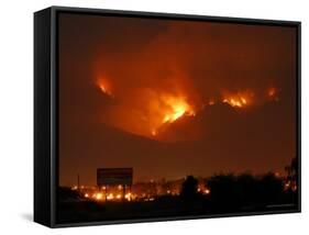 A Wildfire Can be Seen Raging in the Hills Over the Town of St. Ignatius, Montana-null-Framed Stretched Canvas