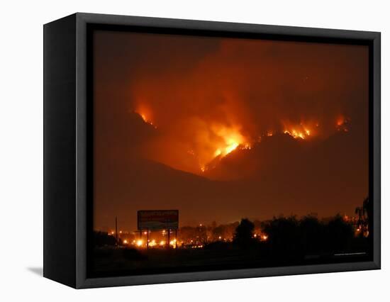 A Wildfire Can be Seen Raging in the Hills Over the Town of St. Ignatius, Montana-null-Framed Stretched Canvas