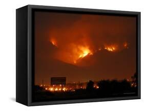 A Wildfire Can be Seen Raging in the Hills Over the Town of St. Ignatius, Montana-null-Framed Stretched Canvas