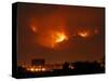 A Wildfire Can be Seen Raging in the Hills Over the Town of St. Ignatius, Montana-null-Stretched Canvas