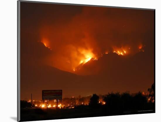 A Wildfire Can be Seen Raging in the Hills Over the Town of St. Ignatius, Montana-null-Mounted Photographic Print