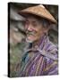 A Wizened Old Farmer Near Mongar Wears the Traditional Knee-Length National Robe Called Gho and a B-Nigel Pavitt-Stretched Canvas