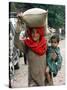 A Woman Carries Relief Supplies at Jula Village, Near Uri, India-null-Stretched Canvas