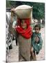 A Woman Carries Relief Supplies at Jula Village, Near Uri, India-null-Mounted Photographic Print