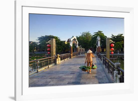 A woman carrying baskets on a yoke over the Lantern Bridge in Hoi An, Quang Nam, Vietnam, Indochina-Alex Robinson-Framed Photographic Print