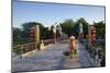 A woman carrying baskets on a yoke over the Lantern Bridge in Hoi An, Quang Nam, Vietnam, Indochina-Alex Robinson-Mounted Photographic Print