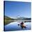 A Woman in a Sea Kayak Paddles on Trillium Lake, Oregon, USA-Gary Luhm-Stretched Canvas