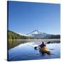 A Woman in a Sea Kayak Paddles on Trillium Lake, Oregon, USA-Gary Luhm-Stretched Canvas