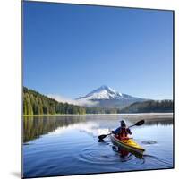 A Woman in a Sea Kayak Paddles on Trillium Lake, Oregon, USA-Gary Luhm-Mounted Photographic Print