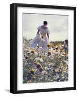 A Woman in a White Victorian Dress, Walking Among Camomile Flowers on a Meadow on a Sunny Day-Malgorzata Maj-Framed Premium Photographic Print