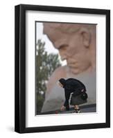 A Woman Lays Flowers on the Unknown Soldier Monument Near the Brest Fortress-null-Framed Premium Photographic Print