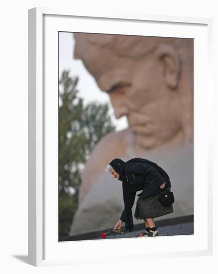 A Woman Lays Flowers on the Unknown Soldier Monument Near the Brest Fortress-null-Framed Photographic Print