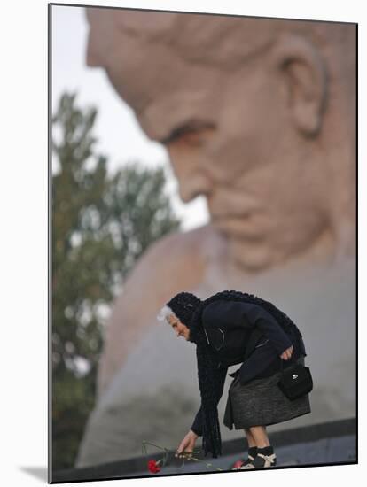 A Woman Lays Flowers on the Unknown Soldier Monument Near the Brest Fortress-null-Mounted Photographic Print