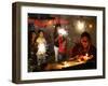 A Woman Lights Earthen Lamps as Children Ignite Firecrackers in New Delhi-Manish Swarup-Framed Photographic Print