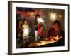 A Woman Lights Earthen Lamps as Children Ignite Firecrackers in New Delhi-Manish Swarup-Framed Photographic Print