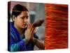 A Woman Offers Prayers to a Banyan Tree Covered by Sacred Thread-null-Stretched Canvas