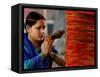 A Woman Offers Prayers to a Banyan Tree Covered by Sacred Thread-null-Framed Stretched Canvas