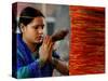 A Woman Offers Prayers to a Banyan Tree Covered by Sacred Thread-null-Stretched Canvas