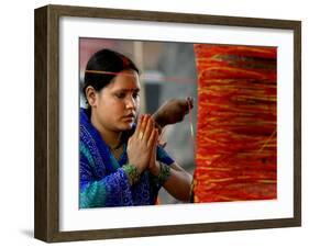 A Woman Offers Prayers to a Banyan Tree Covered by Sacred Thread-null-Framed Photographic Print