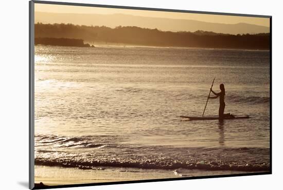 A Woman on a Stand-Up Paddleboard Heads Towards Main Beach, Noosa, at Sunset-William Gray-Mounted Photographic Print